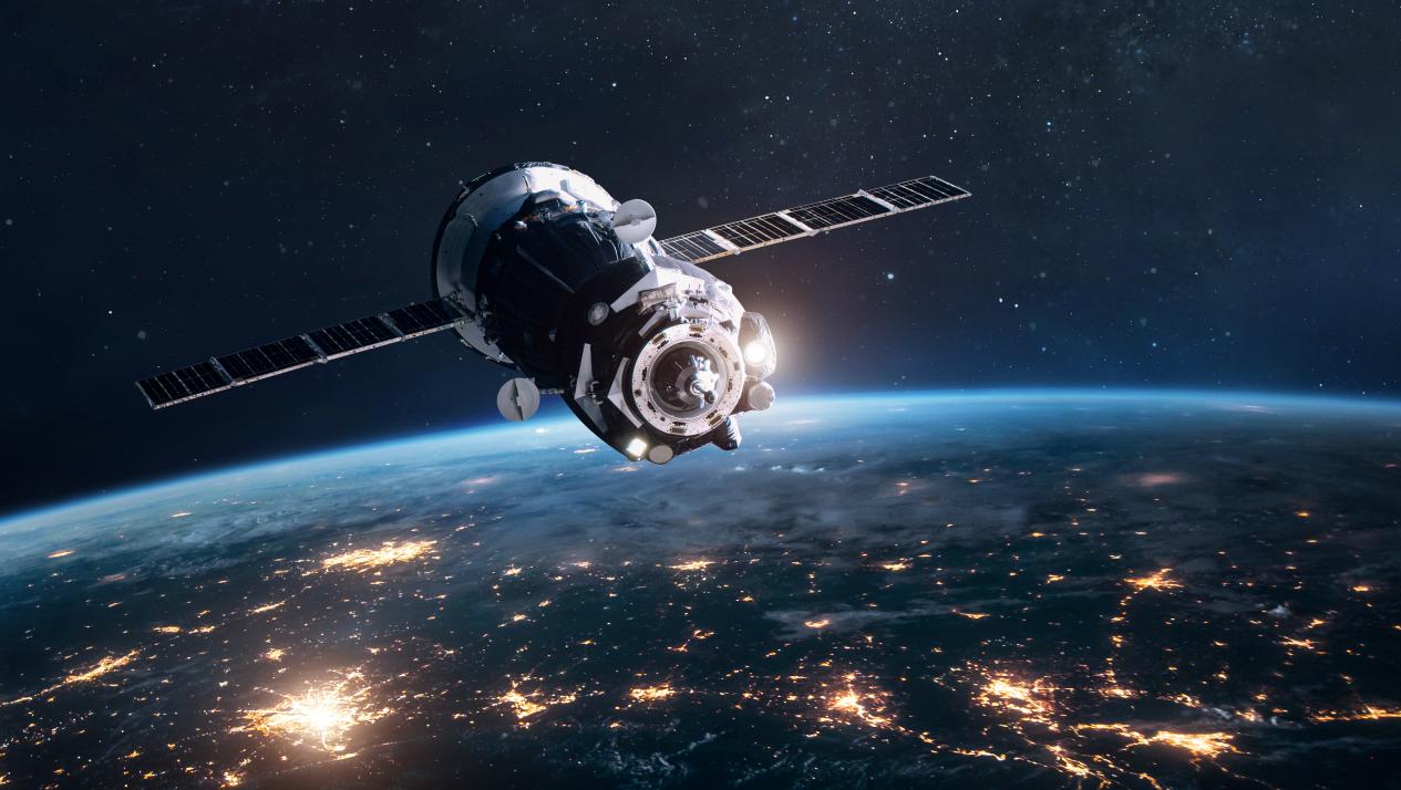 Space ship on orbit of Earth planet. Expedition of cargo spacecraft to ISS. Deep space and cities lights. Elements of this image furnished by NASA.